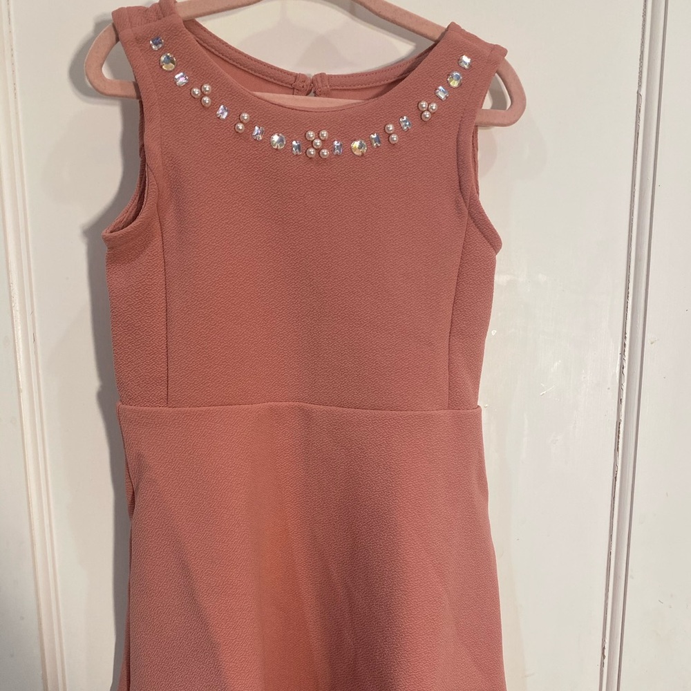 Little girl’s pink dress with studs